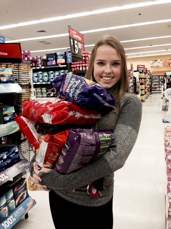 Madi Mills, senior, purchases materials for the upcoming Benny Carnival.  The event will feature carnival-themed activities and service local families, especially those with a disabled individual.