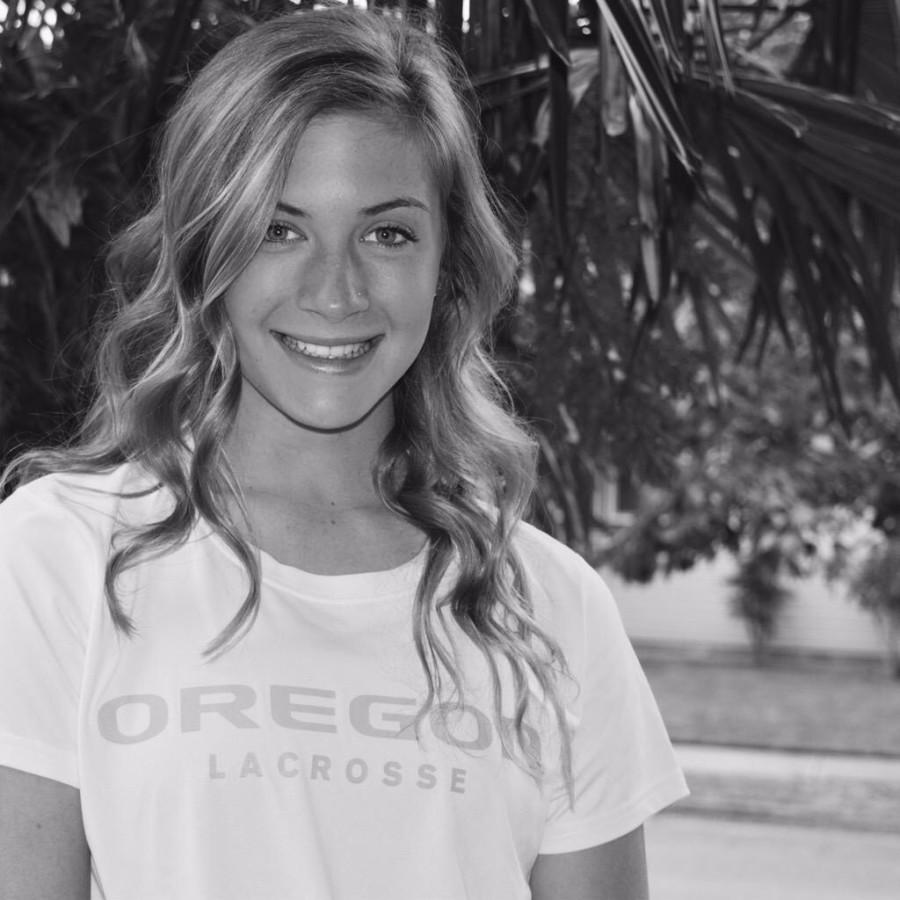 Morgan Finklea, sophomore,  shows off her University Of Oregon  shirt after recently committing to the Duck’s lacrosse program. Finklea, is on the Varsity lacrosse team and was part of the state championship team. 