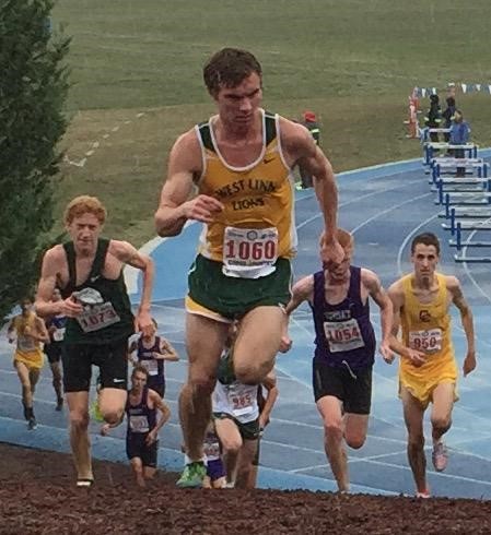 Conor Egan, senior, runs up a steep hill during the OSAA State Championship race. West Linn placed seventh as a team and Egan placed 38th individually with a time of 16:39 minutes. 
