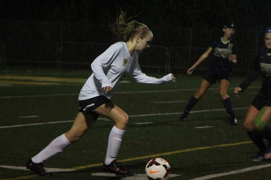 Pushing the ball forward, Abigail Schmidt, 9, sprints through the pouring rain. Girls soccer played Canby this Tuesday in the pouring rain. Leaving with a victory of 2-0. The key to winning this game was our confidence, Ellena Turner, 12 says We had a lot of confidence going in, and had a lot of control over the game. Girls soccer plays Lake Oswego this Thursday. 