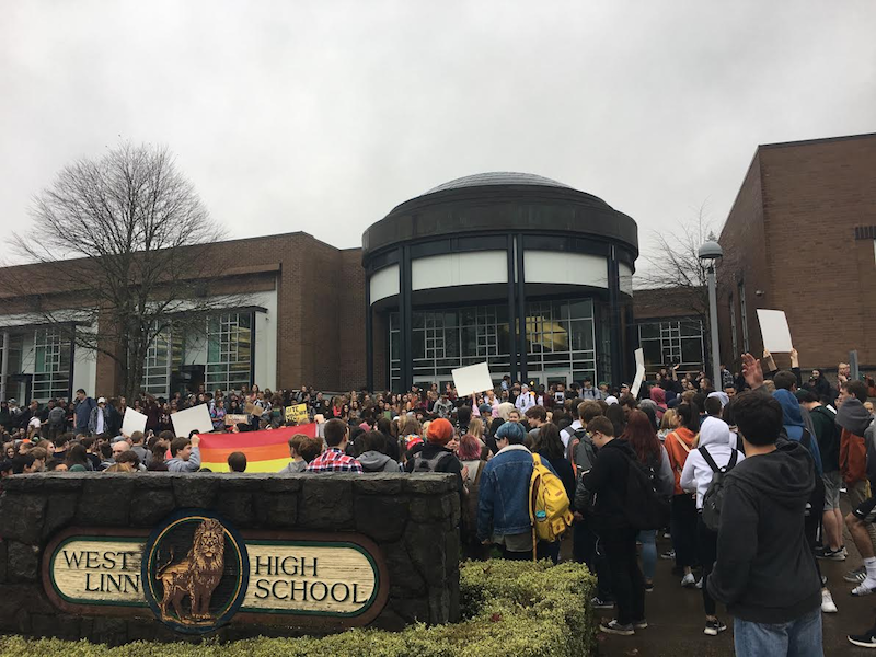 Students gather in front of West Linn to share a message of peace and tolerance. Photo by Philip Chan.