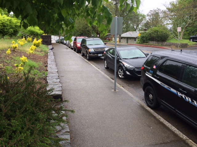 Cars line the street in front of the school as students struggle to find available parking. With numbers still rising, spots will continue to be scarce for years to come. 