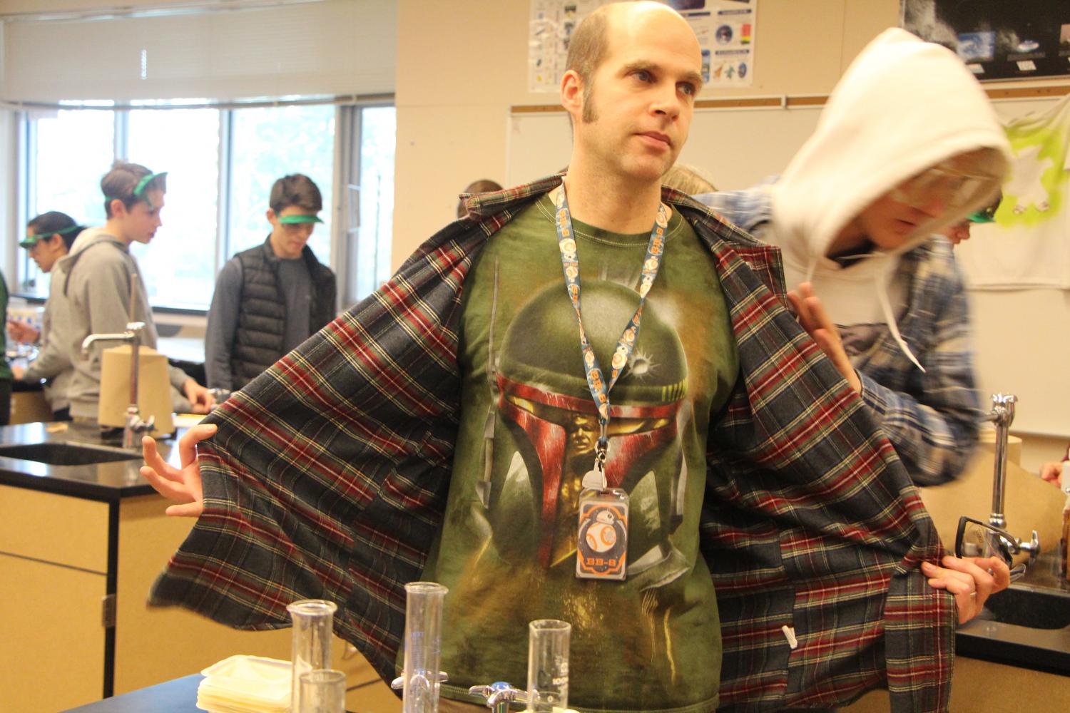Showing+off+his+Star+Wars+Shirt.+Steve+Davala+has+a+passion+for+his+students%2C+Chemistry+and+science+fiction.