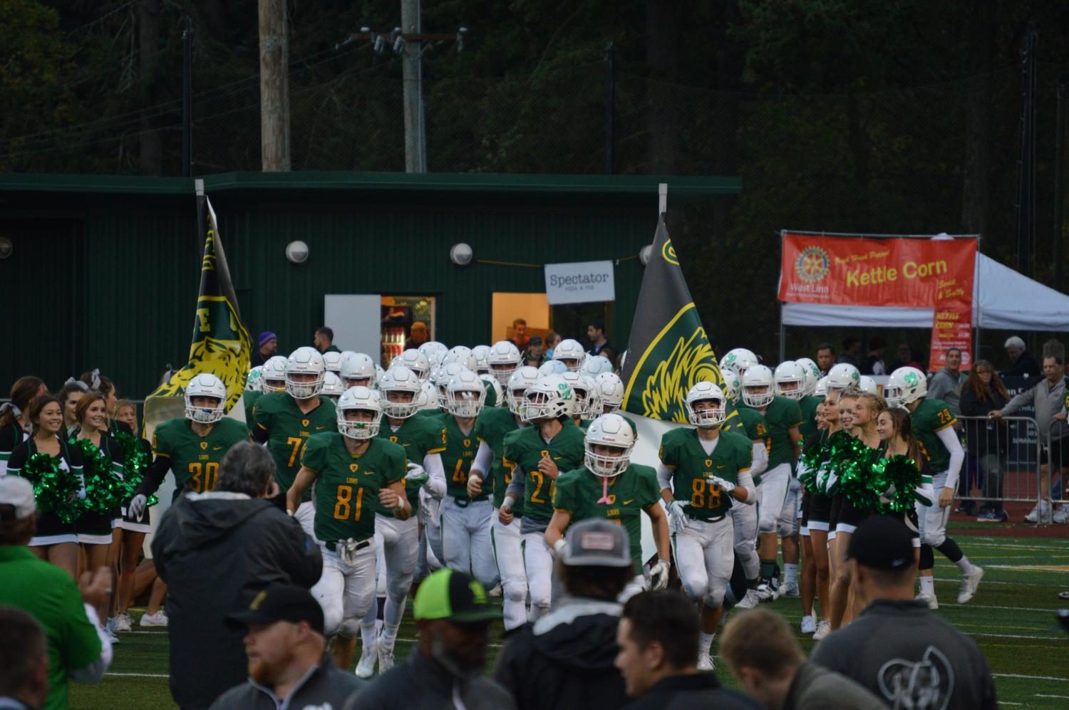 Before their blowout win against Tualatin, the team takes the field after their walk through the student section. Following the dominant victory, West Linn moves to 4-0 on the season (2-0 Three Rivers League) and Tualatin falls to 1-3 (1-1 Three Rivers League).