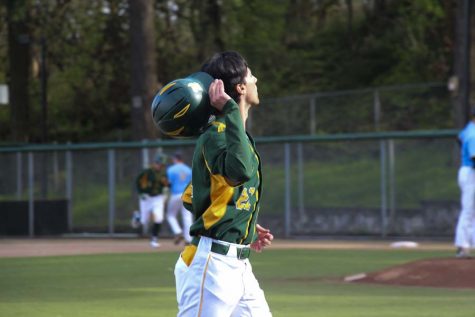 The varsity baseball players geared up to face Lakeridge High School on Monday evening, April 17, at home. This is the fourteenth game of their season. West Linn ended the game with a win (7-3) defeating Lakeridge. In between plays, many of the players basked in the sunlight and cooled off.   

