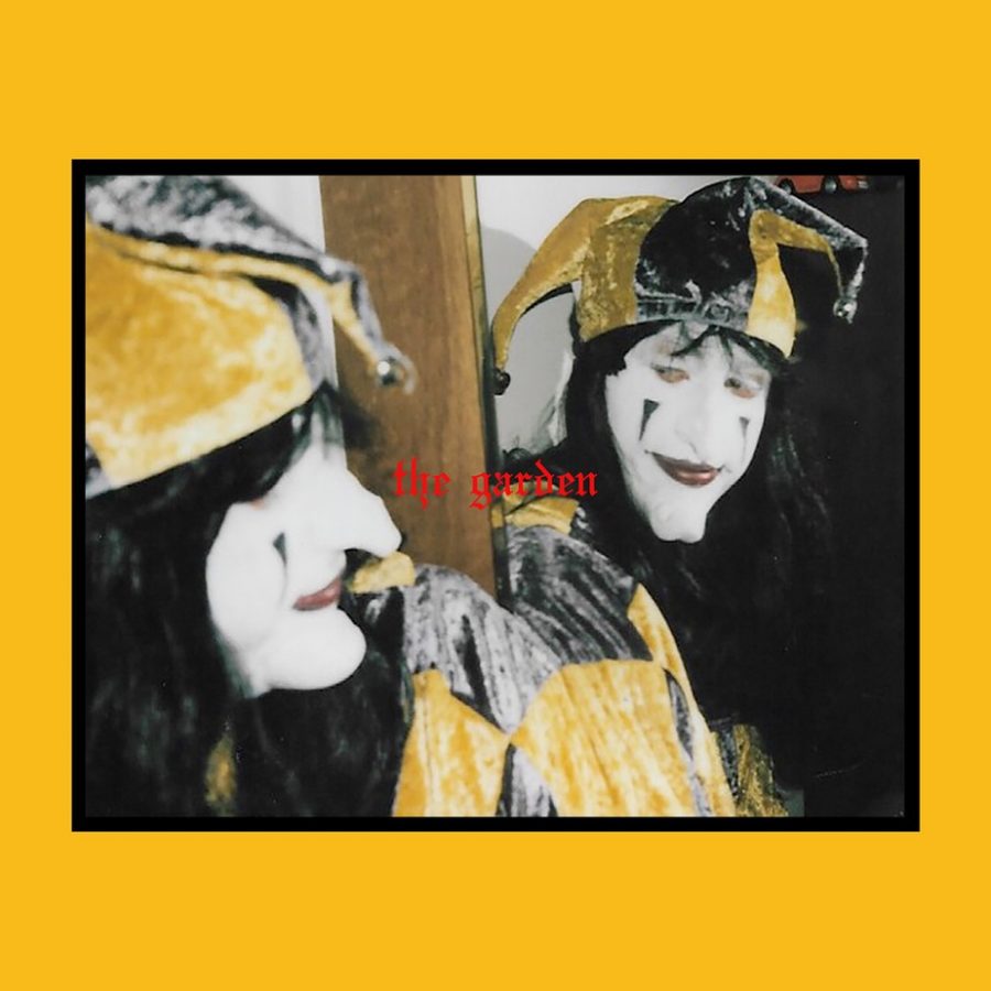 The Garden’s famous icon Joker makes an appearance on the cover of this album “Mirror Meet Your Charm”. The darkness of the image contrasts the yellow, bright background acting as a sort of symbol for their music’s contrasting sounds. 