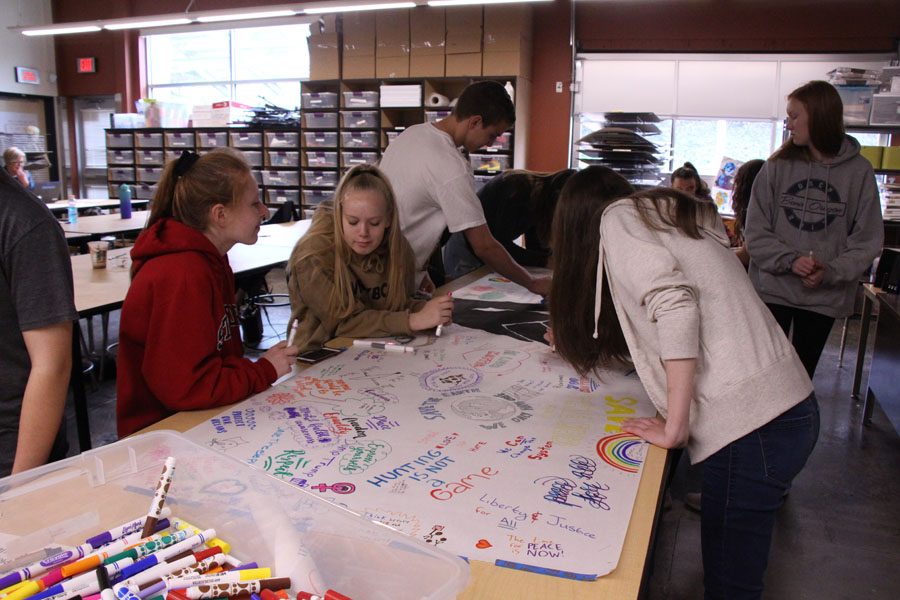 Expressing themselves with bright colored pens; students create a protest art poster. This workshop titled “Art Expression” was also available last year, where students also made a poster, which has been hanging in the Honors Humanities classroom ever since. Ireland Johnson, senior, and Kendra Frankle, senior, led the workshop both years. “We started it last year for Unity Day, and at the time there was a lot of rep around protests being really bad, people  were not really understanding what they were and what they meant, we wanted to spread awareness and teach people what protest is, and how it is not just some terrible thing, it doesn’t turn into riots all the time, it actually is important.” Frankle said, “People should stand up for what they believe in.” 
