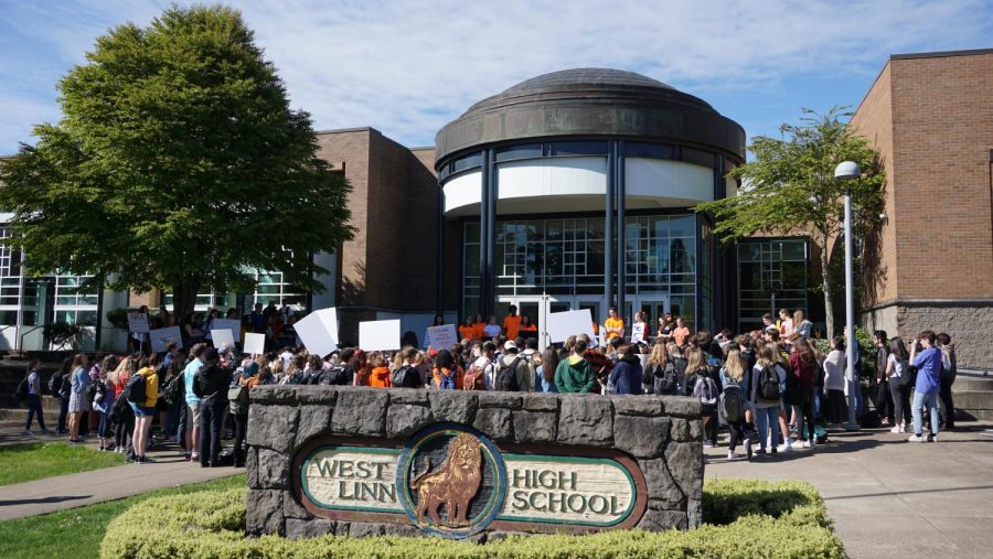 Students+gather+outside+the+school+to+protest+gun+violence+on+April+20%2C+2018.