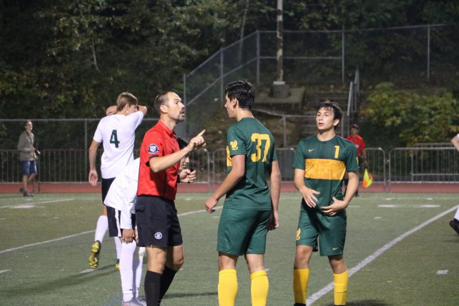 After an altercation with a referee, Jacob Babalai, senior, receives a red card. The West Linn student section was not happy, beginning to shout and chant “Free Jacob.”