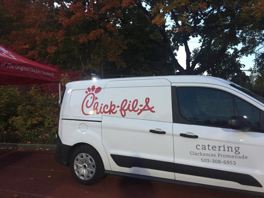 Parked on the track, the Chick-fil-A vendor makes its first reappearance at the game against Lake Oswego, after an accident kept it from being present at two consecutive home games. 
