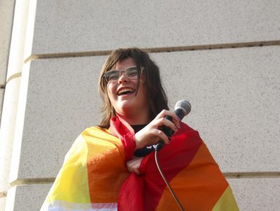 Standing in front of at least 100 people, Susie Walters, senior, laughs as she starts her speech about inclusion to the present student body. Co-president of Gender Sexuality Alliance, Walters organized the walkout on Nov. 8 to celebrate the LGBTQ+ community at the school. “The purpose of this demonstration is to allow students to show solidarity with their LGBTQ+ peers and to peacefully address the culture of intolerance on the WLHS campus,” a press release published by GSA stated. Walters soon shared her own story and the message for the demonstration. “I want you to treat this day, and the rest of your life, like a pride celebration,” Walters said. 