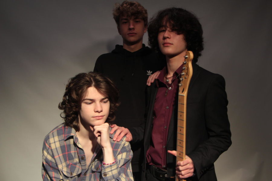 Preparing for their debut performance at the May Day celebration, freshman Connor Beck, Dylan Smith, and Nigel Cross make up the three piece garage rock trio Midsommar. 