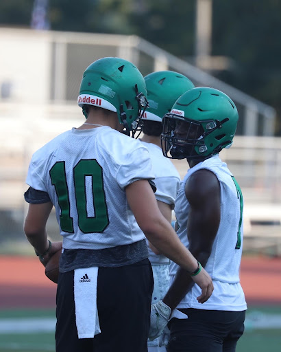 Leavitt and Kouame share a laugh during Aug. 30 practice. After losing the semifinal the previous year, transfer Leavitt looks to make a difference for the Lions. “I’ve been loving everything [like] the environment, the practices we get going, everything’s on point, we’re crisp,” Leavitt said. 
