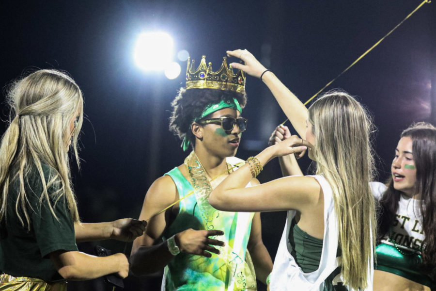 During halftime of the football game, Sky Gomes, senior and ASB president, crowns Ajani White, senior, for Homecoming royalty. Out of six seniors, three were elected to be royal. Among elected were White, Angie Nelson, and Drew Ness. “I was in shock,” White said. “I really did not expect it. I feel great. I feel like its a great group and I feel honored to be a part of it.”
