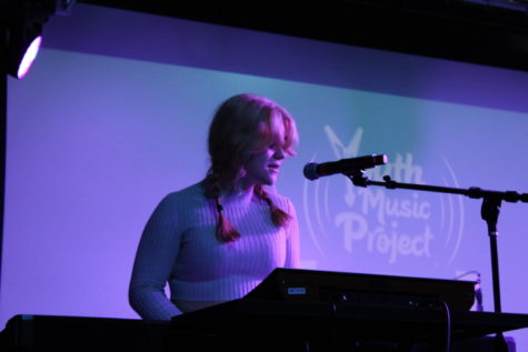 Luci Armstrong, sophomore, is one of the many people occupying the stage at Youth Music Project’s February Teen Open Mic. Tonight she performs a new unnamed original song as well as “Out of My League” by Fitz and The Tantrums.