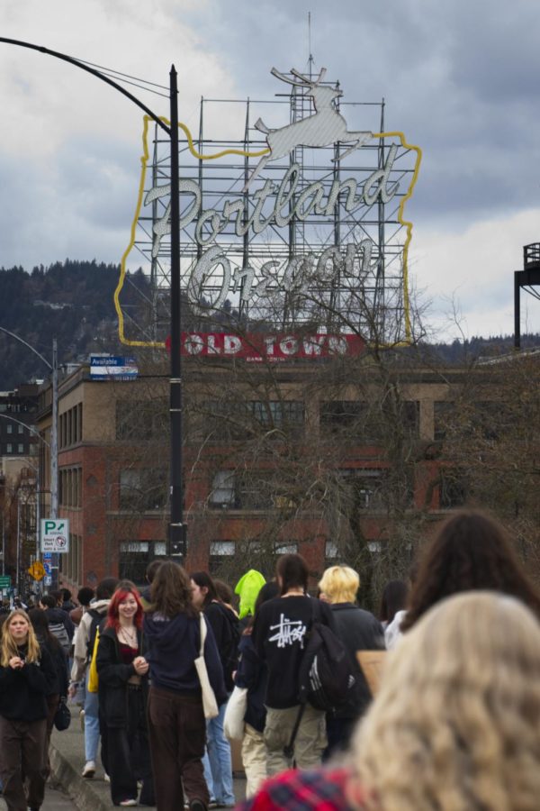 As the group of 2500+ youth crosses west over the Burnside Bridge, the Portland, Oregon Stag sign sits overhead.