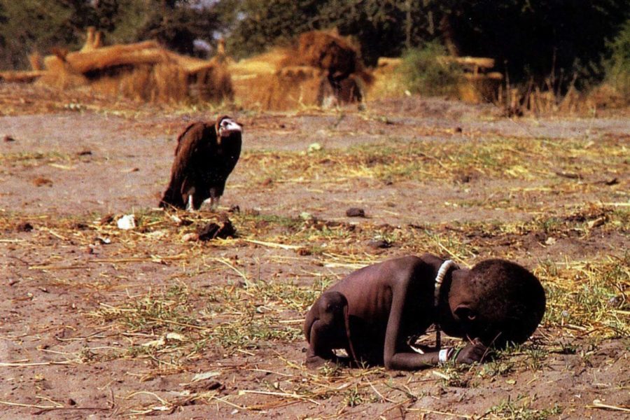 A photo by Kevin Carter first appearing in the NY times, found on rarehistoricalphotos.com