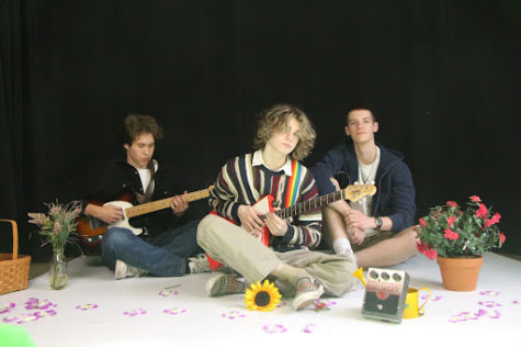 Queen Anne’s Lace poses for a photo. From left to right, Adam Chapin on guitar, Connor Beck on lead vocals and guitar, and Wyatt Foster on bass.
