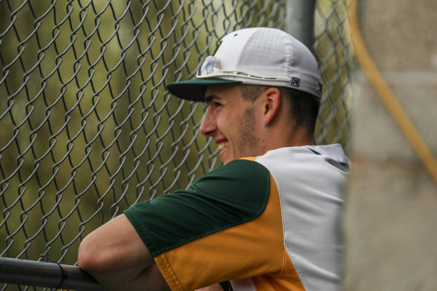 Drake Gabel, senior, smiles as he watches the bottom of the fourth inning. Winning 11—1, the baseball team managed to get their 15th win on the season thanks to 13 combined hits. The baseball team will look to play Lake Oswego again on May 5 to decide the season series. 