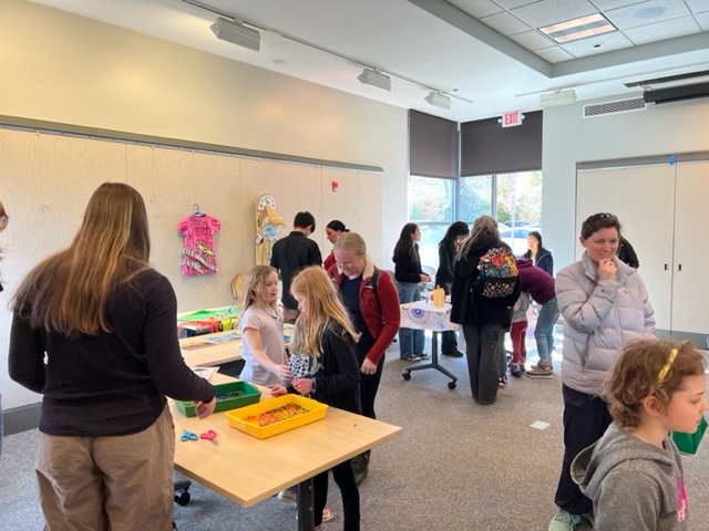 People filter in and out of the community room at the public library to learn about Indigenous culture. Basket weaving, jewelry making, and artwork were modified for elementary-aged students to immerse themselves in Indigenous traditions. 