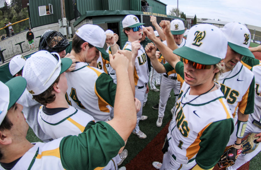 In preparation for the upcoming game, the baseball team breaks the huddle. Playing the Lake Oswego Lakers on May 3, the game started at 5 p.m. at home. After losing to Lake Oswego on May 2, the baseball team beat them 11—1 in five innings.