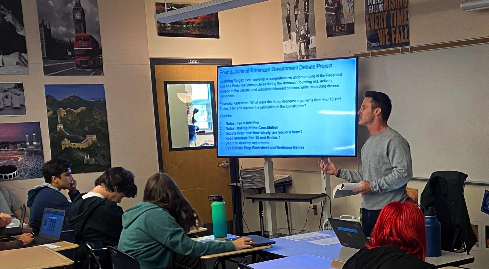 Kyle Rumrey explains a federalism debate project to his Advanced Placement (AP) Government during the third period.