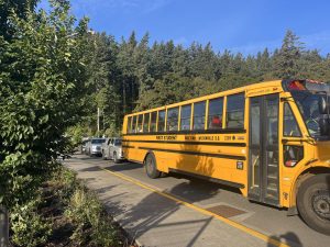 Buses and cars line up in the morning on Skyline before school starts.