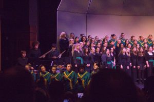 All together. To finish off the concert, all choirs joined on stage to perform “Water Fountain,” a song inspired by the California drought in 2013. Several students were seated on the edge of the stage clapping and playing percussion instruments to add to the sound. The song involved shouting, singing, and clapping. 