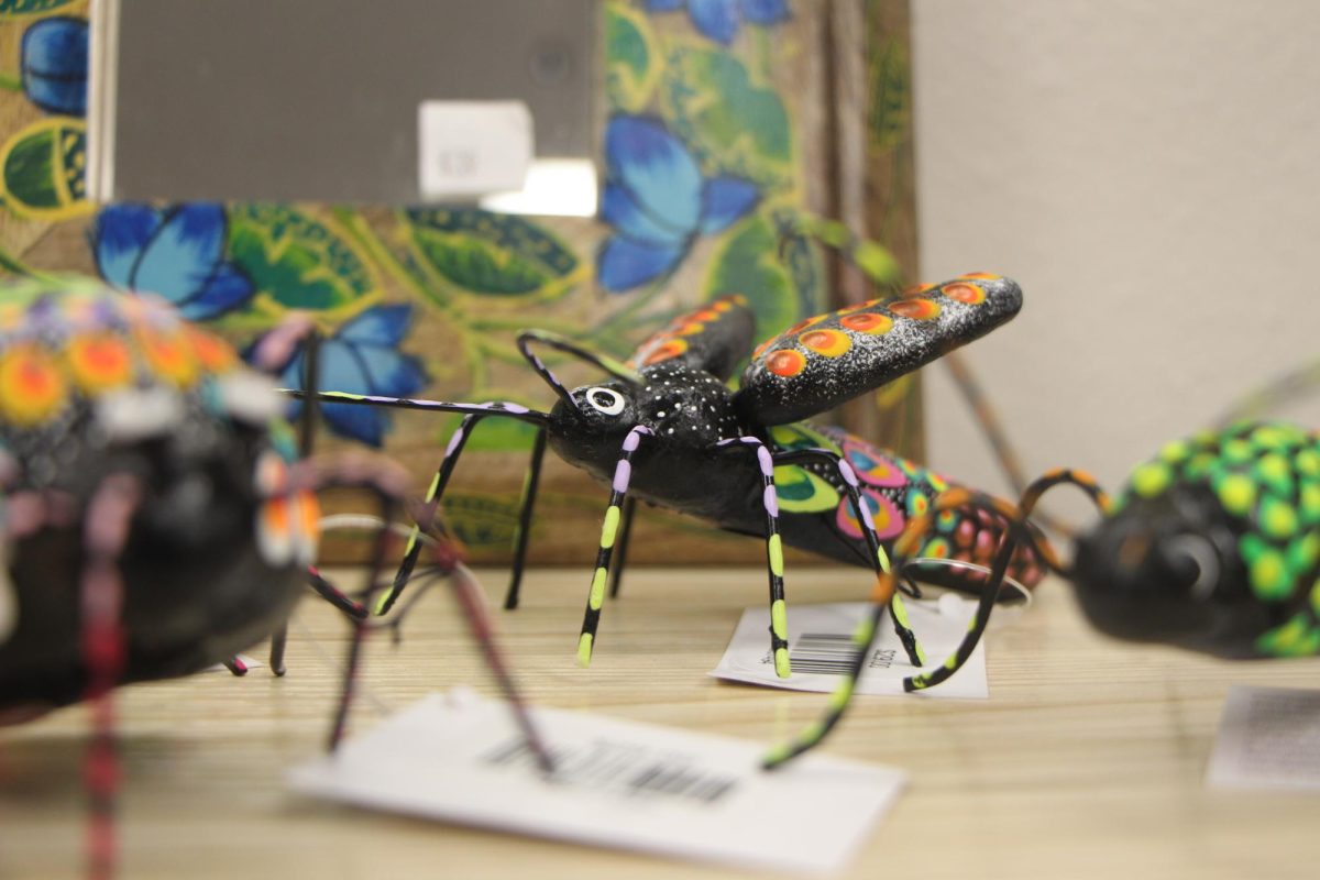 Buzzing business. A third-generation ceramic artist hand paints and sculpts bugs made with wire framework. The artist from Mexico creates designs on each of the insects, utilizing an assortment of colors. May connects with the artists through organizations and yearly conferences run by Fairtrade, and has had the opportunity to meet several artists in person. The connections made at the conferences directly affect the items for sale. “The word we hear the most is that we’re very unique,” May said.