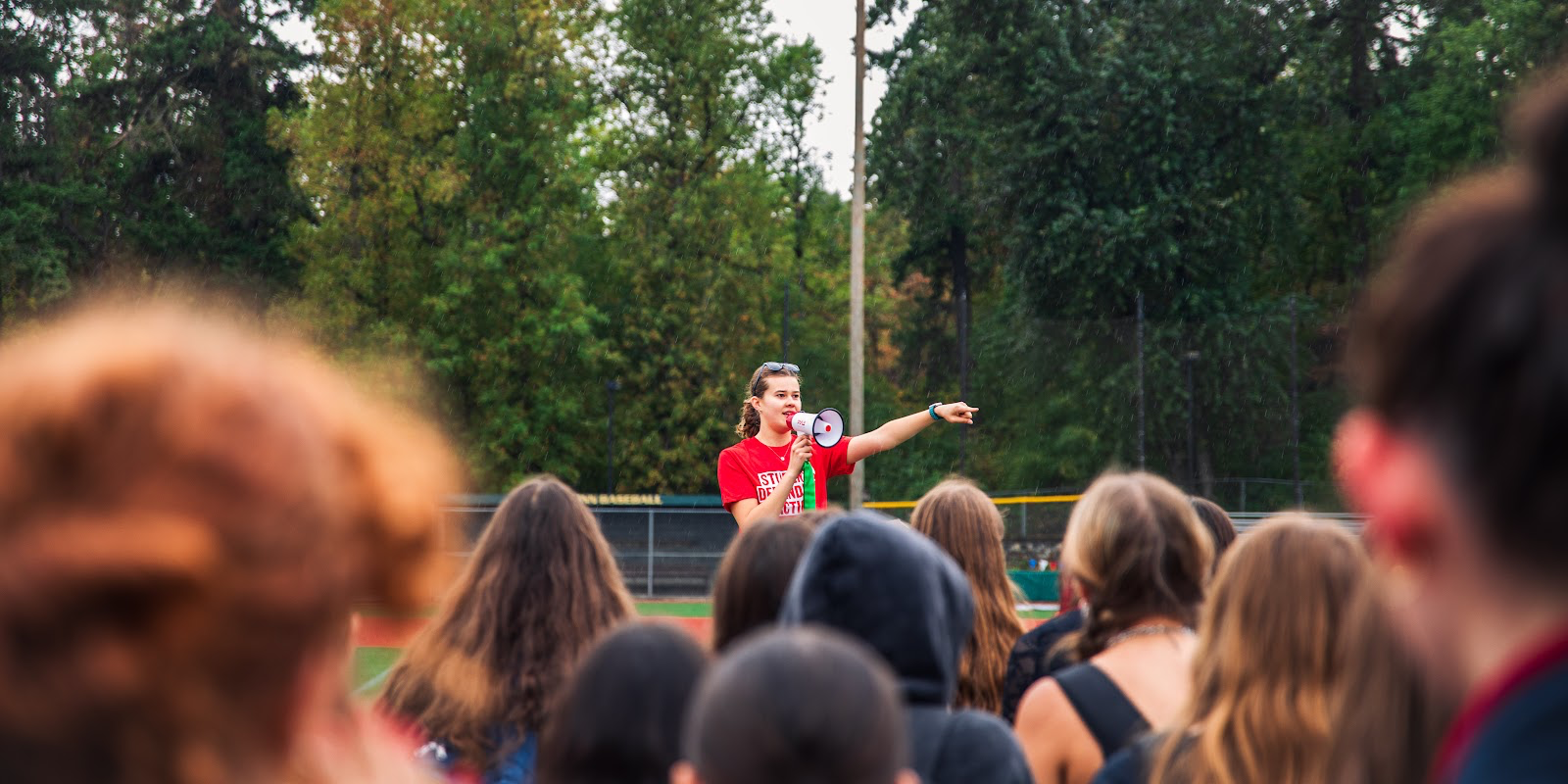 Brooklyn Carr Heuer, senior, speaks to the attendees of the Sept. 5 walkout for school shooting awareness.