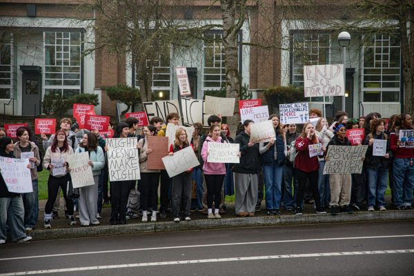 Students gathered in front of West Linn High School to start off the protest, where they would chant and raise their signs to the oncoming traffic.