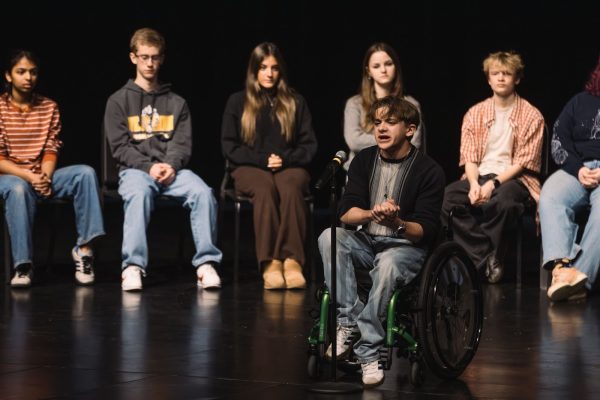 Finley Parker, sophomore, delivers his poem “When Death Comes” by Mary Oliver. 