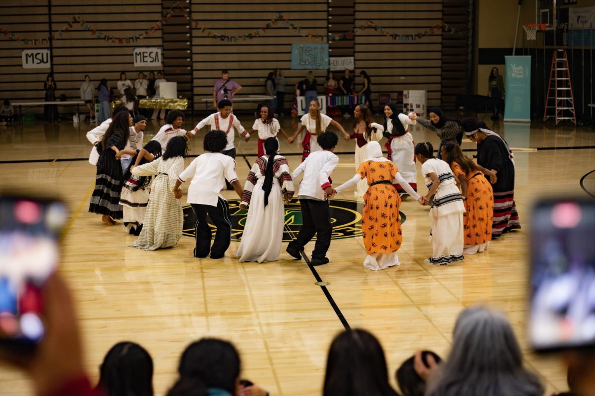 CIRCLE OF FRIENDS. Ethiopian students from inside and outside the district united to perform a routine celebrating Ethiopian culture while dressed in outfits they showcased at the fashion show.